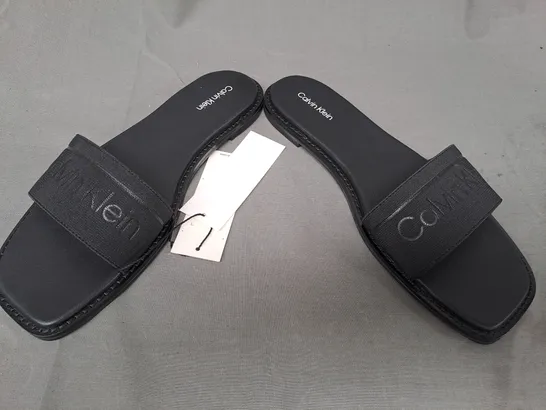 BOXED PAIR OF CALVIN KLEIN FLAT SLIDERS IN BLACK UK SIZE 6