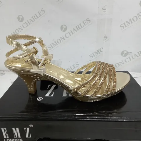 BOX OF APPROXIMATELY 5 GEMZ LONDON GOLD GEM HEELS 