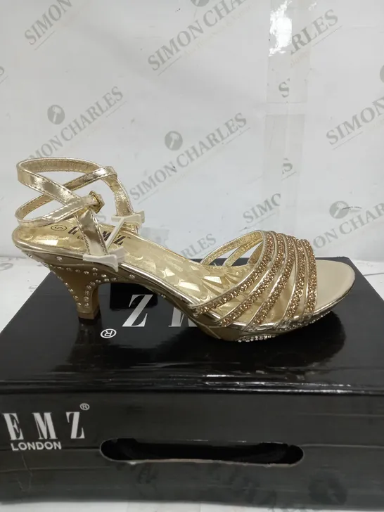 BOX OF APPROXIMATELY 5 GEMZ LONDON GOLD GEM HEELS 