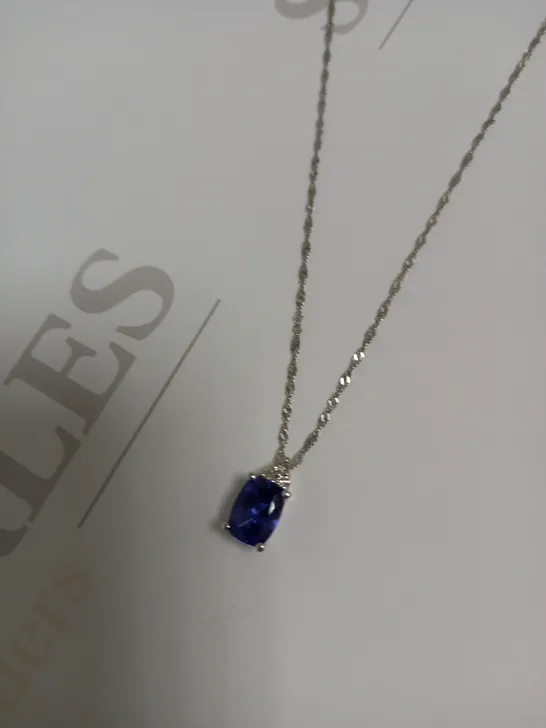 DESIGNER 18CT WHITE GOLD PENDANT ON A CHAIN, SET WITH AN OVAL CUT TANZANITE AND DIAMONDS WEIGHING +-1.44CT