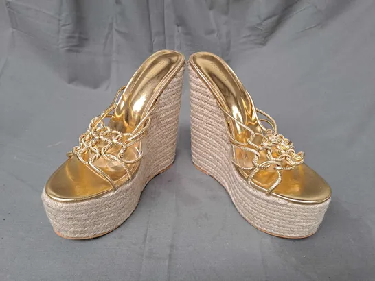 BOXED PAIR OF DESIGNER HIGH WEDGE SANDALS IN METALLIC GOLD SIZE 6