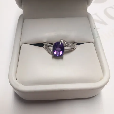 DESIGNER 9CT WHITE GOLD RING SET WITH AN OVAL CUT AMETHYST AND DIAMONDS WEIGHING +1.09CT