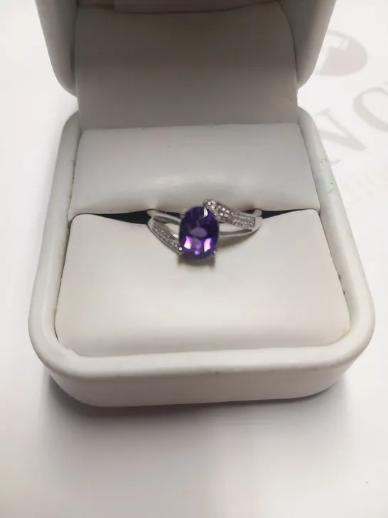 DESIGNER 9CT WHITE GOLD RING SET WITH AN OVAL CUT AMETHYST AND DIAMONDS WEIGHING +1.09CT