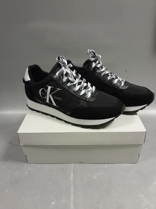 BOXED PAIR OF CALVIN KLEIN CAYLE BLACK FABRIC TRAINERS - 8