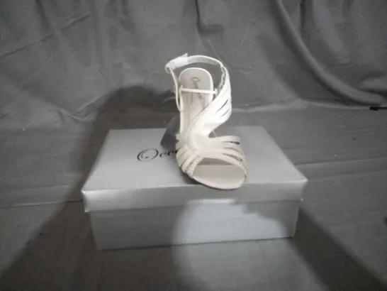 APPROXIMATELY 12 BOXED PAIR OF CASANDRA IVORY HEELED SANDALS IN VARIOUS SIZES TO INCLUDE SIZE 5