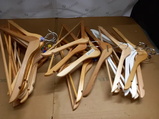 large quantity of assorted wooden clothes hangers in plastic crate