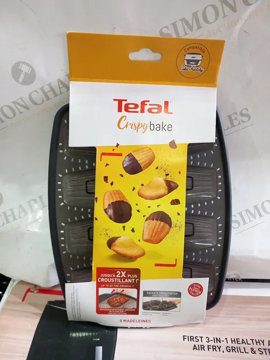 APPROXIMATELY NINE TEFAL CRISPY BAKE 8 MADELINES