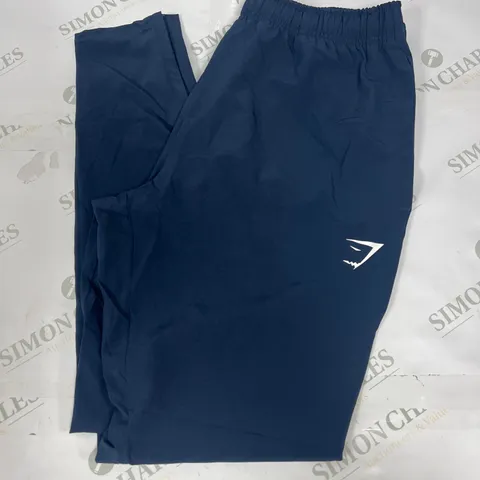 GYMSHARK TRACK PANTS IN NAVY SIZE MEDIUM 