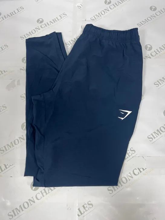 GYMSHARK TRACK PANTS IN NAVY SIZE MEDIUM 