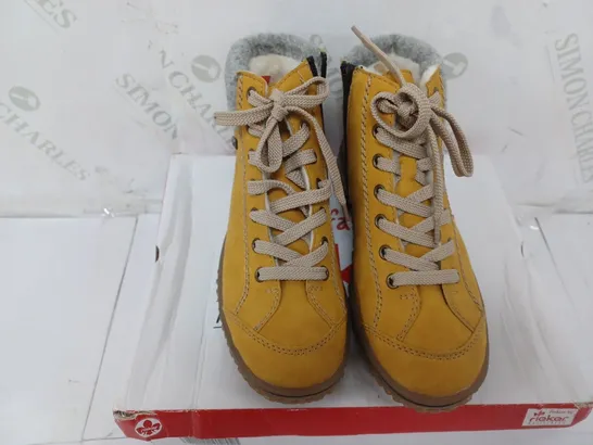 BOXED PAIR OF RIEKER LACE UP WATER RESISTANT BOOTS IN YELLOW SIZE 4