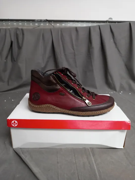 BOXED PAIR OF RIEKER SIDE ZIP WATER RESISTANT BOOTS IN BURGUNDY SIZE 6