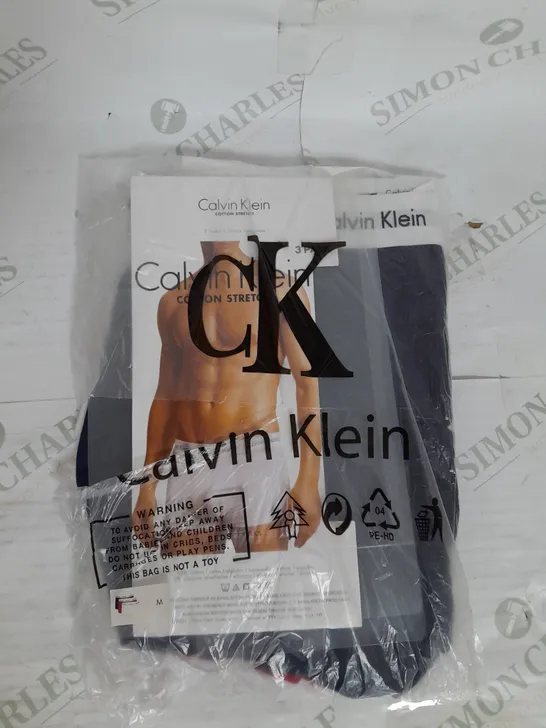 CALVIN KLEIN COTTON STRETCH 3 PACK TRUNKS IN WHITE RED AND BLUE SIZE M