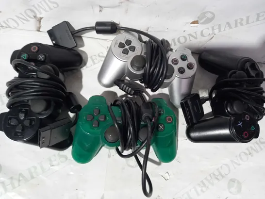 BOX OF ASSORTED SONY PLAYSTATION WIRED CONTROLLERS IN VARIOUS COLOURS