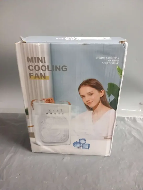 THREE BOXED MINI COOLING FANS