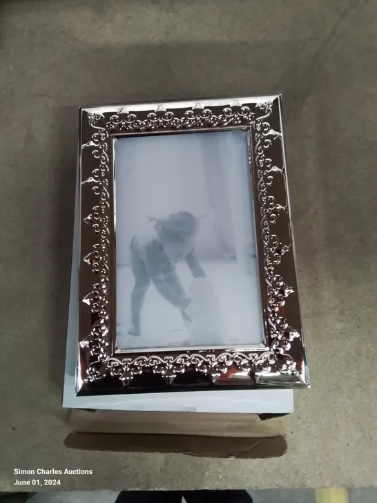 A PACK OF FOUR 4×6 PHOTO FRAMES WITH SILVER FINISH 