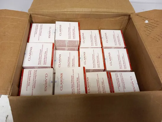 APPROXIMATELY 43 BOXED CLARINS PARIS GENTLE BEAUTY SOAP WITH SHEA BUTTER AND HAZLENUT OIL 150G EACH