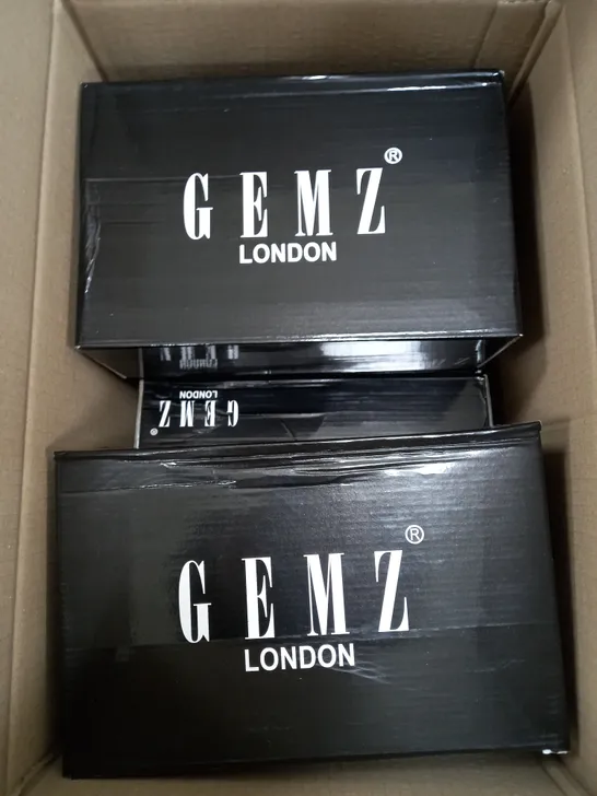 BOX OF APPROXIMATELY 5 GEMZ LONDON GOLD GEM HEELS 