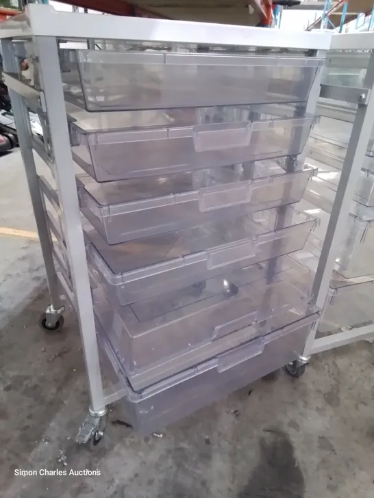 TWO METAL FRAMED TROLLEYS WITH 5 CLEAR PLASTIC GRADUATED TRAYS