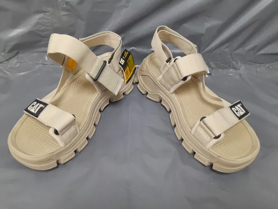 BOXED PAIR OF CATERPILLAR OPEN TOE LOW WEDGE SANDALS IN BEIGE EU SIZE 40