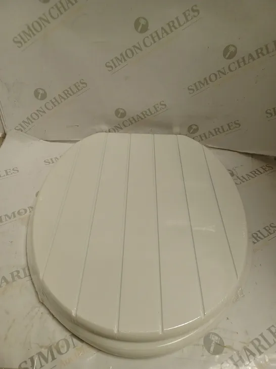 BOXED AND SEALED MDF TOILET SEAT. 