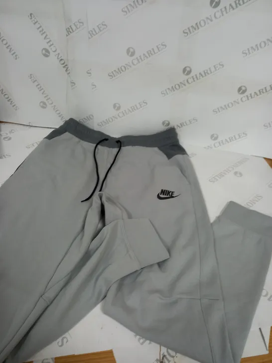 NIKE GREY TRACKSUIT BOTTOMS - MEDIUM 