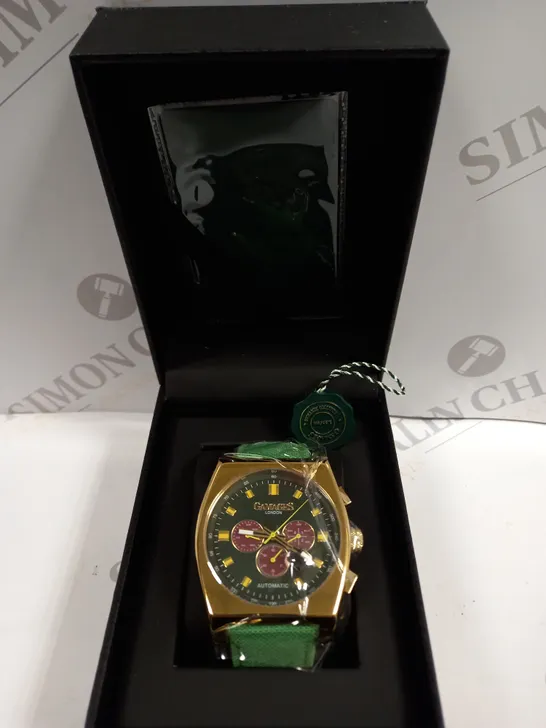 BOXED GAMAGES RETRO CALIBRE GOLD EFFECT CASE GREEN STRAP WATCH 