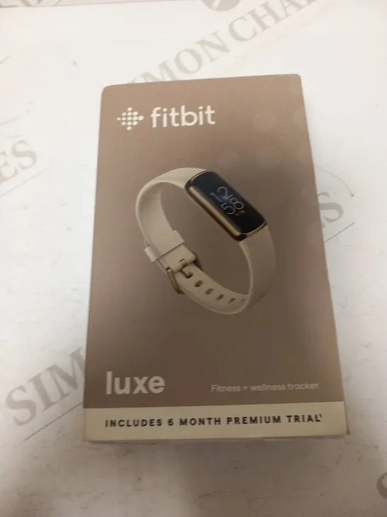 BOXED AND SEALED FITBIT LUXE FITNESS AND WELLNESS TRACKER