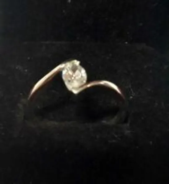 18CT WHITE GOLD SOLITAIRE TWIST RING SET WITH A MARQUIS CUT DIAMOND