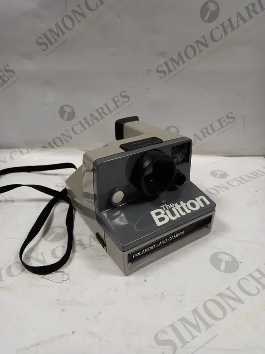 POLAROID THE BUTTON LAND CAMERA 