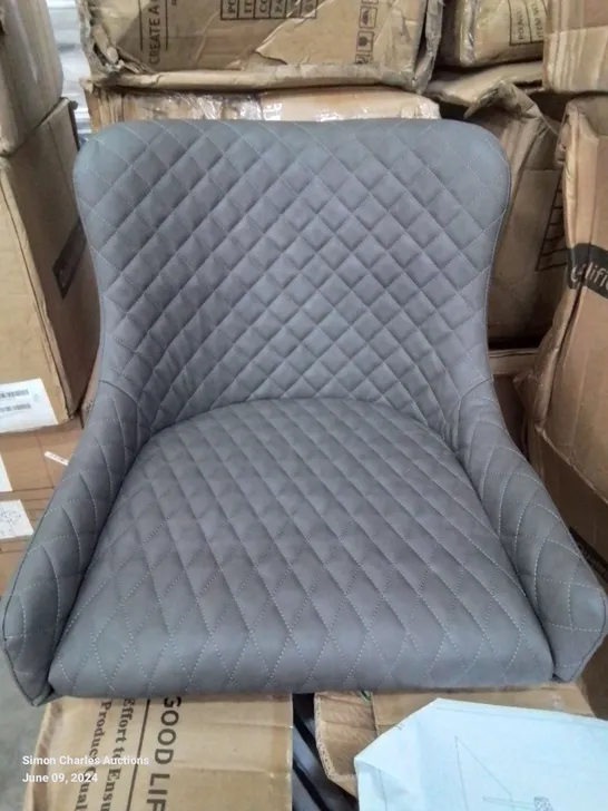 A BOXED PAIR OF GREY FAUX LEATHER UPHOLSTERED DINING CHAIRS