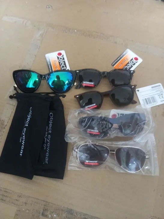 BOX OF APROX 100 SUN GLASSES IN VERSUS DESIGN AND COLOR 