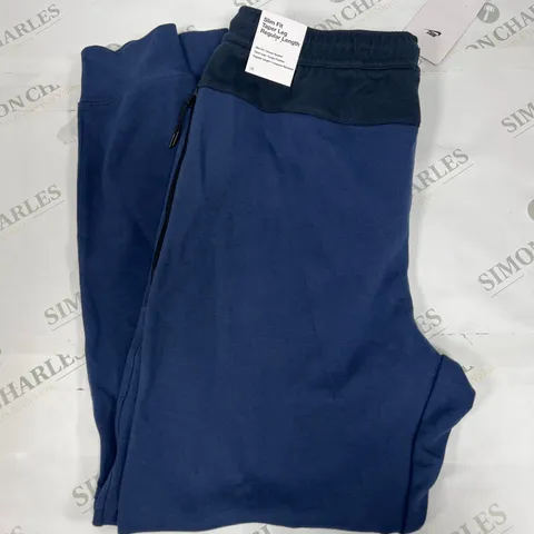 NIKE SLIM FIT PANTS IN BLUE AND BLACK SIZE MEDIUM