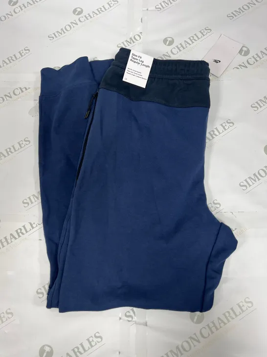 NIKE SLIM FIT PANTS IN BLUE AND BLACK SIZE MEDIUM