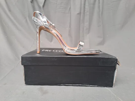 BOXED PAIR OF PRETTY LITTLE THING OPEN TOE HIGH HEEL SANDALS IN METALLIC SILVER UK SIZE 8