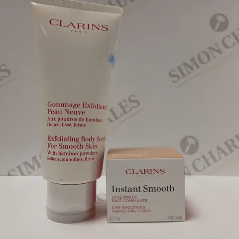 BOX OF 2 CLARINS PRODUCTS TO INCLUDE EXFOLIATING BODY SCRUB & INSTANT SMOOTH LINE-SMOOTHING PERFECTING TOUCH 