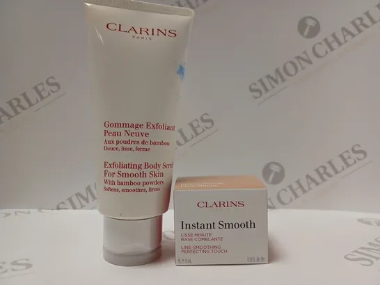 BOX OF 2 CLARINS PRODUCTS TO INCLUDE EXFOLIATING BODY SCRUB & INSTANT SMOOTH LINE-SMOOTHING PERFECTING TOUCH 