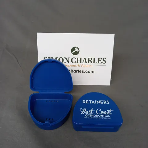 BOX OF APPROXIMATELY 100 ORTHOCARE RETAINER BOXES IN BLUE 