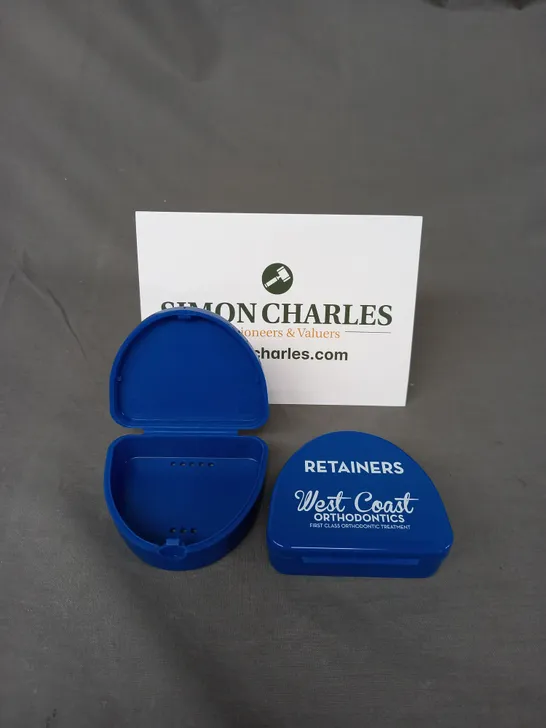 BOX OF APPROXIMATELY 100 ORTHOCARE RETAINER BOXES IN BLUE 