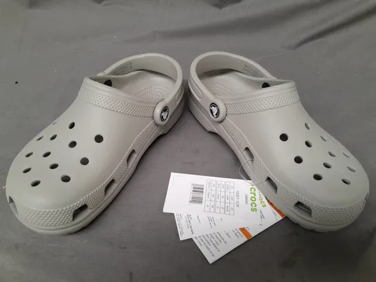 PAIR OF CROCS CLASSICS IN GREY UK SIZE M3/W4