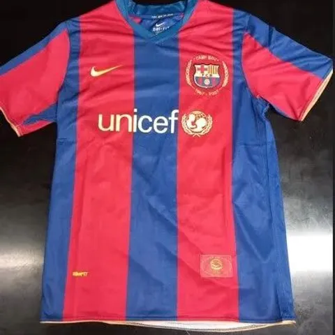 BARCELONA FC HOME JERSEY SIGNED BY LIONEL MESSI WITH CERTIFICATE OF AUTHENTICITY