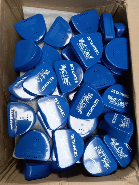 BOX OF APPROXIMATELY 100 ORTHOCARE RETAINER BOXES IN BLUE 