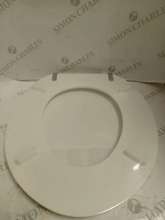 BOXED AND SEALED MDF TOILET SEAT. 