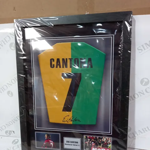 FRAMED ERIC CANTONA PRINT- DEPICTING A SIGNED SHIRT- SIGNATURE IS NOT PRINTED NOT HAND WRITTEN